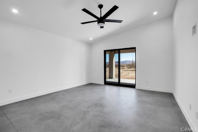 unfurnished room with ceiling fan and vaulted ceiling