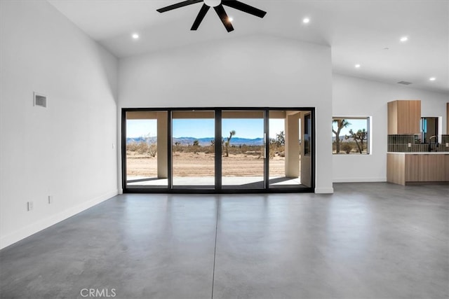 unfurnished living room with sink, ceiling fan, and high vaulted ceiling