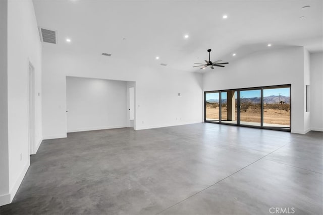 interior space with a high ceiling and ceiling fan