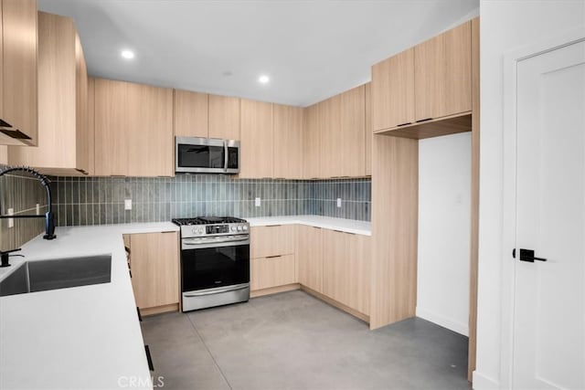 kitchen with backsplash, light brown cabinets, sink, and stainless steel appliances