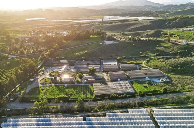drone / aerial view featuring a mountain view