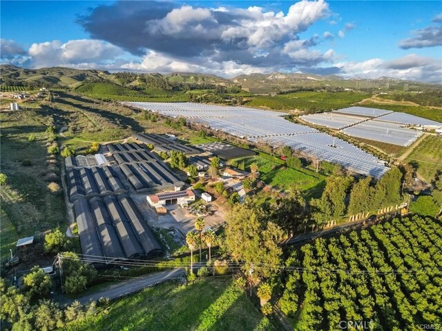 drone / aerial view featuring a mountain view