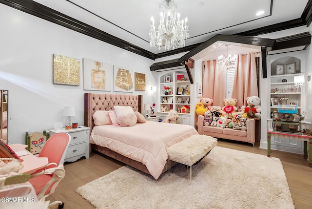 bedroom featuring crown molding, light hardwood / wood-style floors, and a chandelier