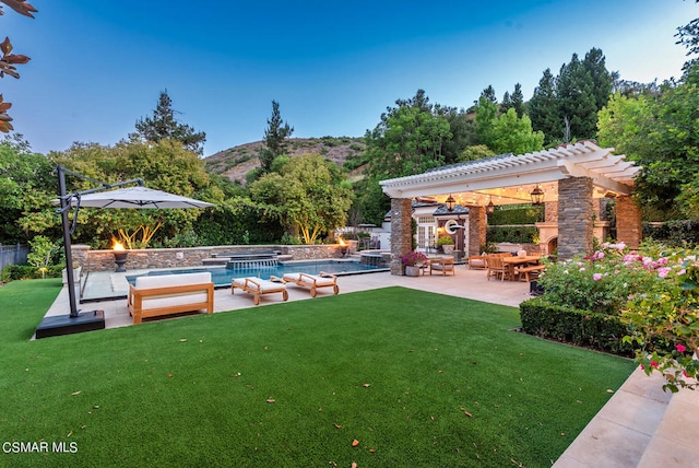 view of yard with a patio and a mountain view