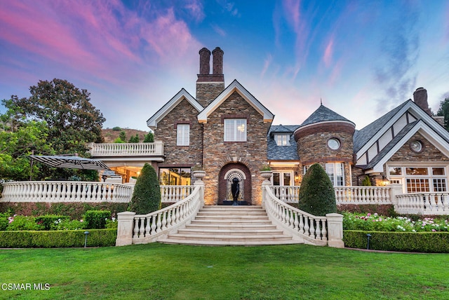 view of front of house with a yard