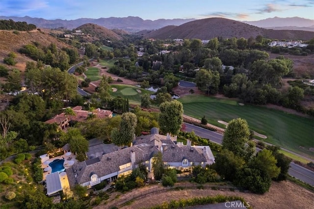 birds eye view of property with a mountain view