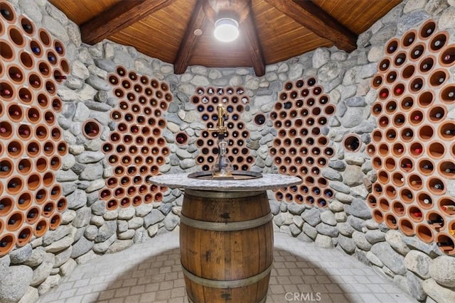 wine cellar with beam ceiling and wood ceiling