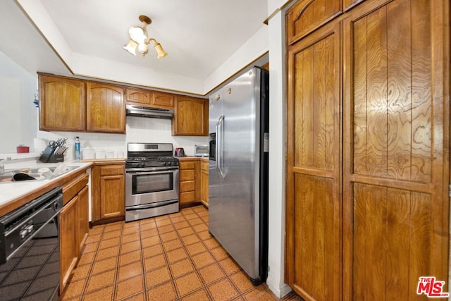 kitchen with appliances with stainless steel finishes and sink