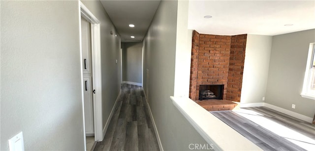 corridor featuring dark hardwood / wood-style flooring