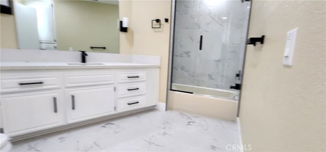 bathroom with shower / bath combination with glass door and vanity