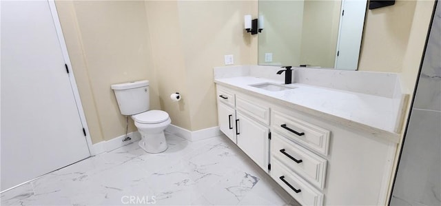 bathroom with toilet, marble finish floor, vanity, and baseboards