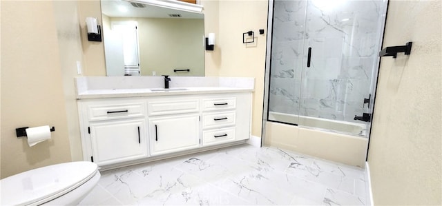 full bathroom featuring shower / bath combination with glass door, vanity, and toilet