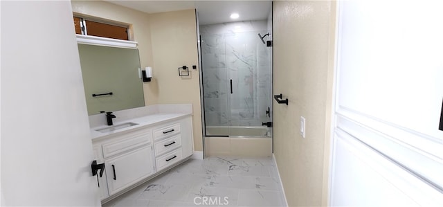 bathroom with vanity and enclosed tub / shower combo