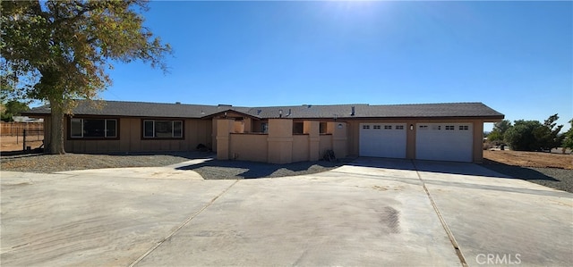 ranch-style home featuring a garage