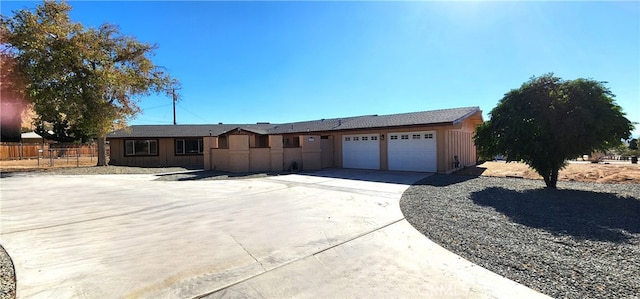 ranch-style house featuring a garage