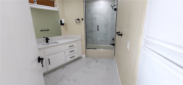 bathroom featuring bath / shower combo with glass door and vanity