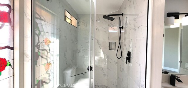 bathroom with a shower with shower door