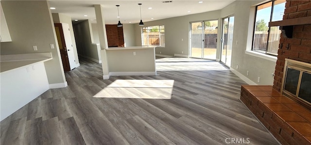 unfurnished living room featuring dark hardwood / wood-style flooring