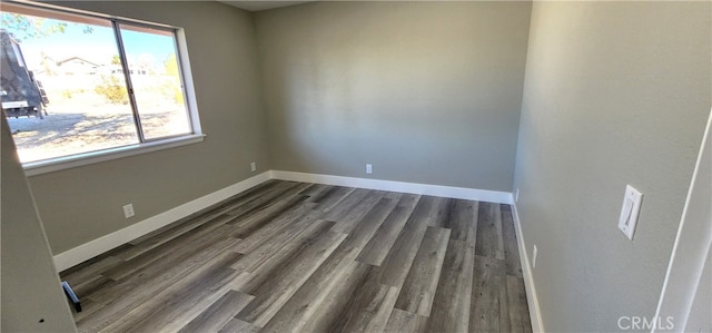 unfurnished room featuring dark hardwood / wood-style flooring