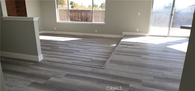 spare room with hardwood / wood-style flooring