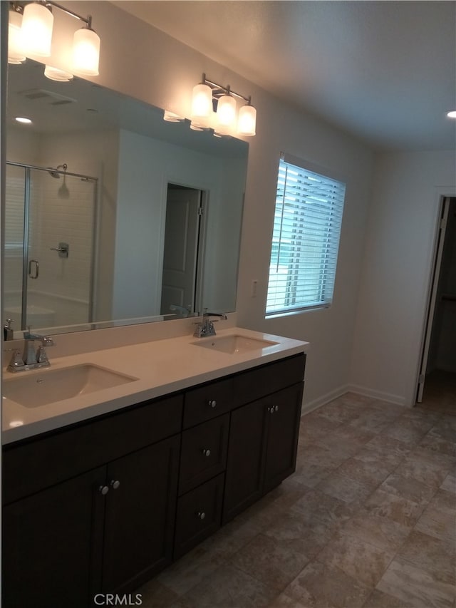 bathroom with vanity and walk in shower