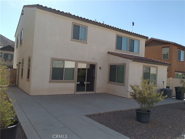 rear view of house featuring a patio