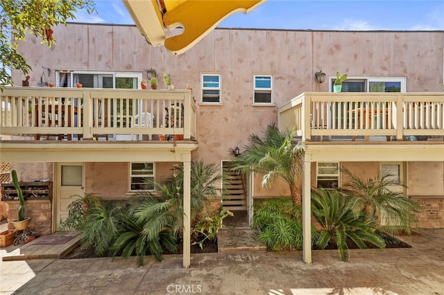 221 Termino Ave, Long Beach, CA 90803 - rear view of property featuring a balcony and stucco siding