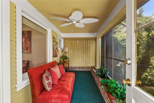 sunroom / solarium with a wealth of natural light and ceiling fan