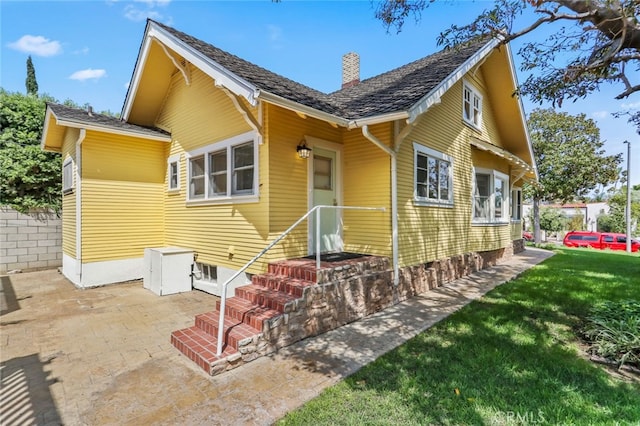 221 Termino Ave, Long Beach, CA 90803 - bungalow-style house with a chimney, a front yard, and a patio area