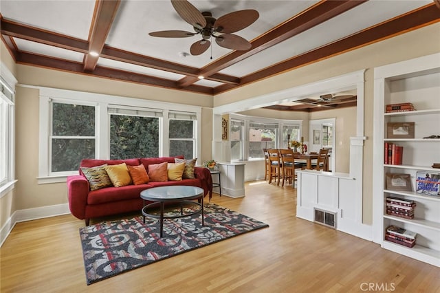 living room with beam ceiling, coffered ceiling, light hardwood / wood-style floors, and ceiling fan