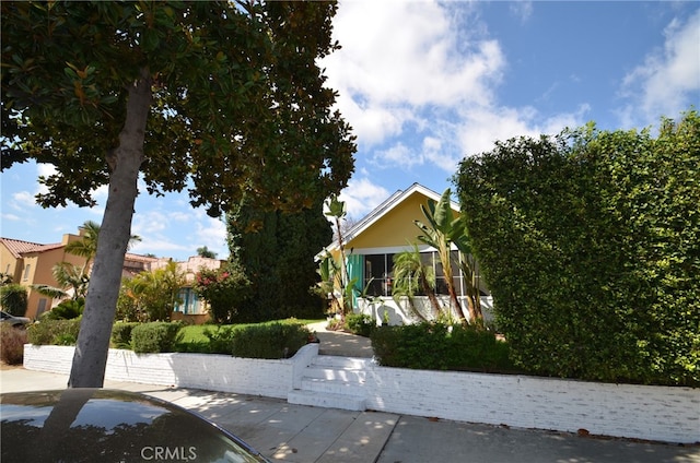 view of property hidden behind natural elements