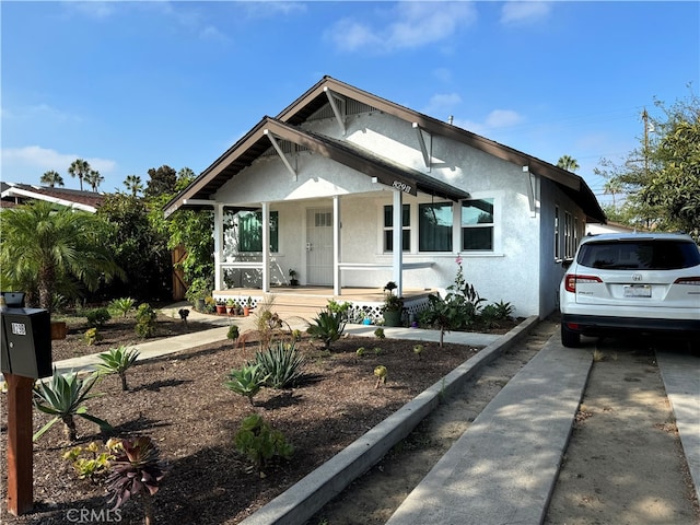 bungalow-style home featuring covered porch