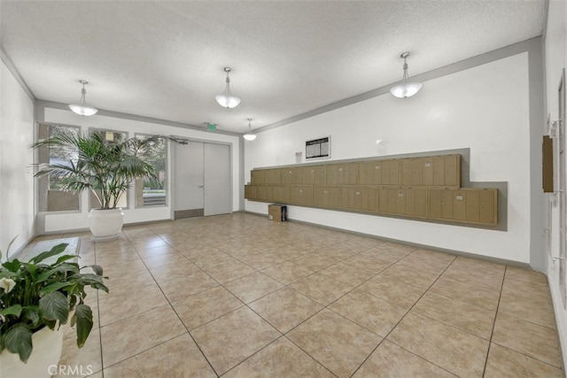 interior space featuring a textured ceiling and light tile patterned floors