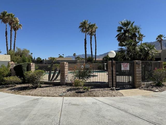 view of gate featuring a mountain view