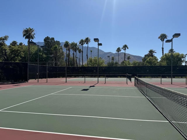 view of sport court with a mountain view and basketball court