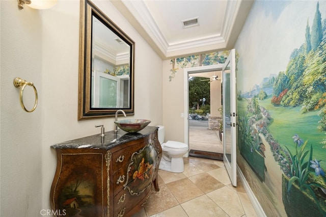 bathroom featuring crown molding, vanity, and toilet