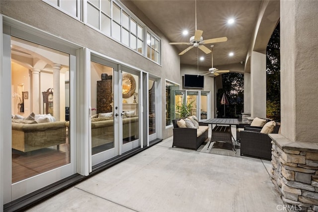 view of patio with ceiling fan and outdoor lounge area