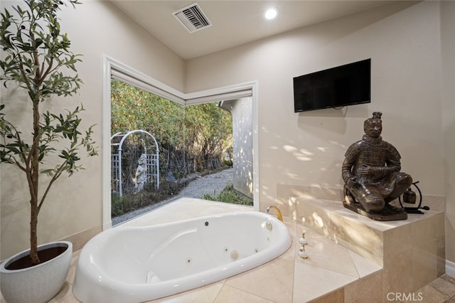 bathroom featuring tiled bath