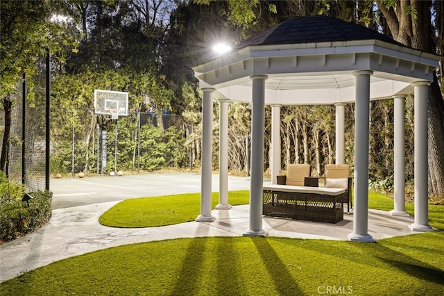 view of home's community with a gazebo, a yard, and basketball court