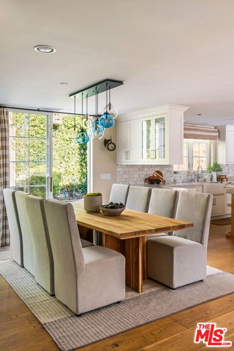 dining space with light hardwood / wood-style flooring