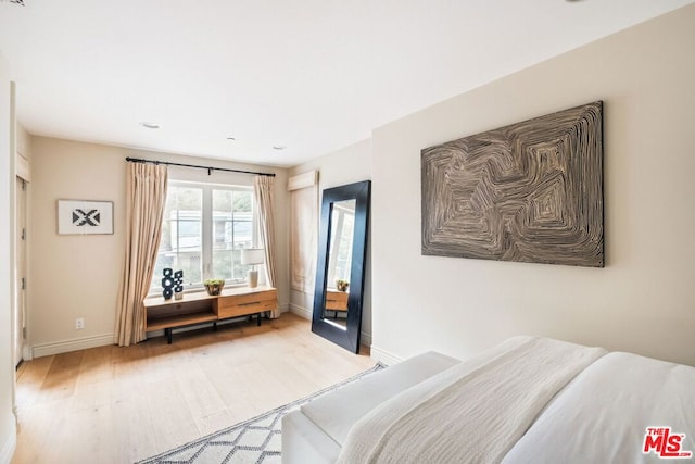 bedroom with light wood-type flooring