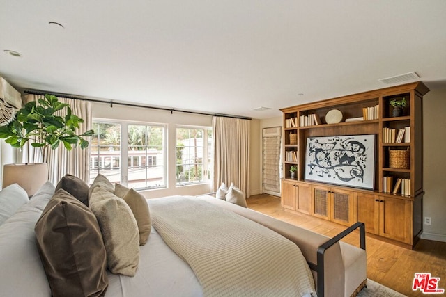 bedroom with light hardwood / wood-style floors