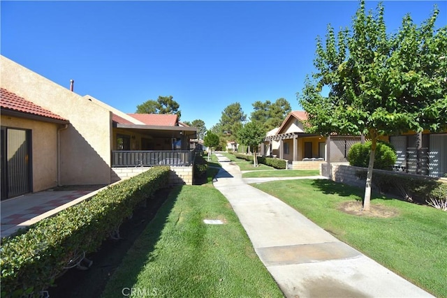 view of community featuring a lawn