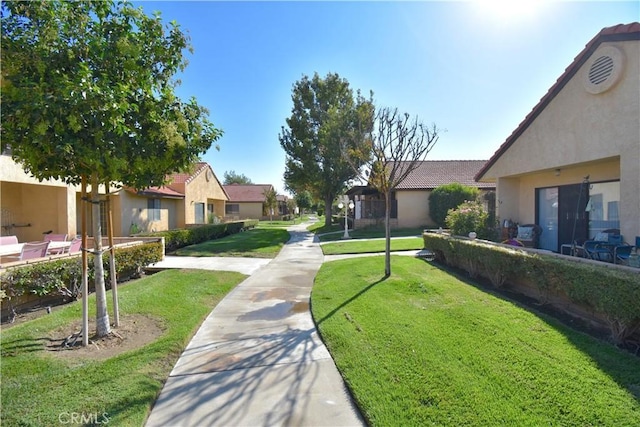 view of home's community featuring a lawn