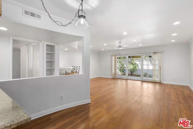 unfurnished living room with ceiling fan, crown molding, and hardwood / wood-style flooring