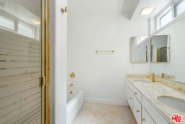 bathroom with vanity, tile patterned floors, and independent shower and bath