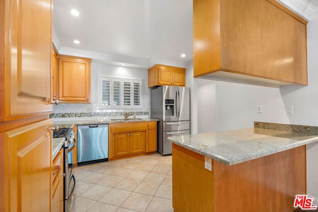 kitchen featuring sink, ornamental molding, light stone counters, kitchen peninsula, and stainless steel appliances