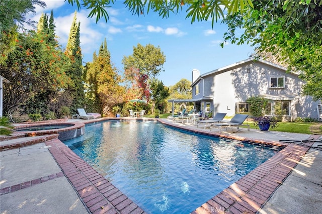 view of swimming pool with a patio and an in ground hot tub