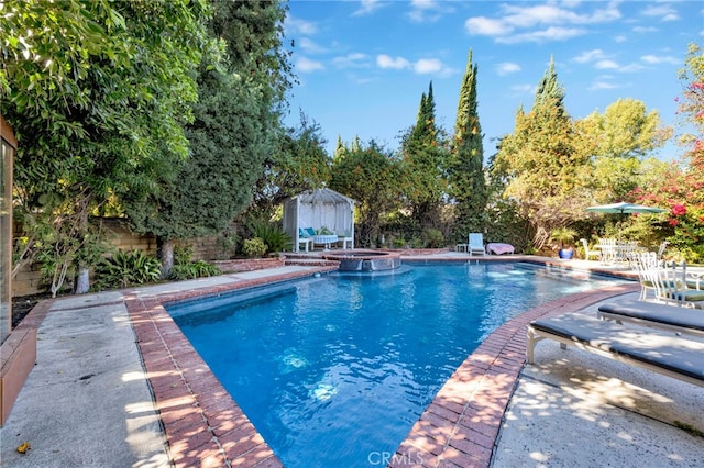 view of swimming pool featuring a patio area