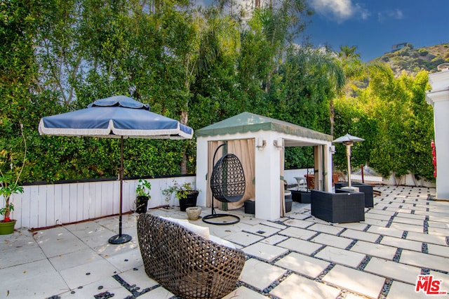 view of patio / terrace featuring a gazebo and an outdoor hangout area